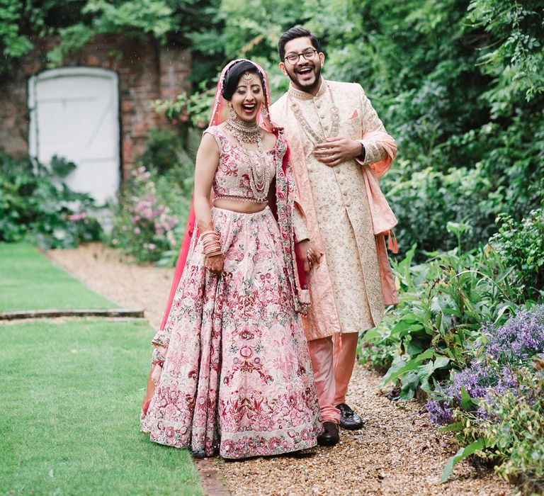 Indian bride and groom portrait in the gardens at Northbrook Park by Jessy Papasavva Photography