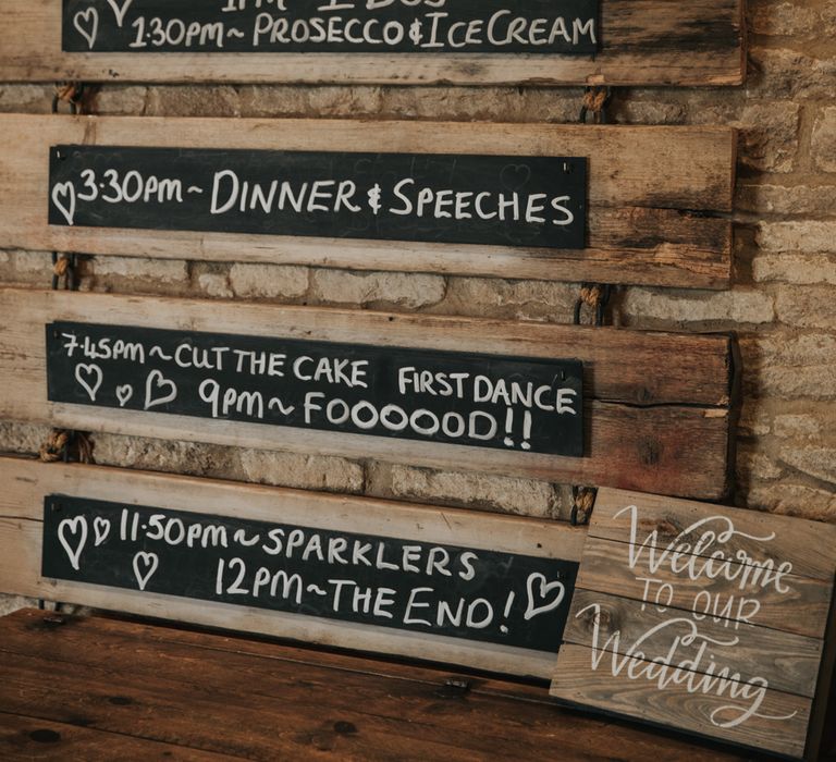 Wedding order of the day on chalk and wood sign