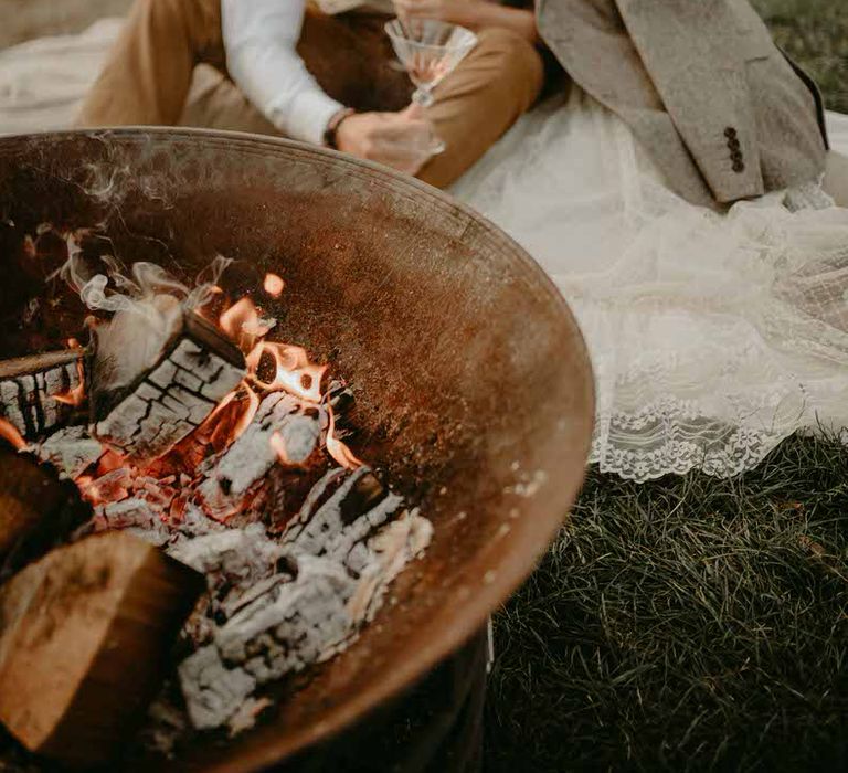 Outdoor fire pit for a sustainable boho wedding reception