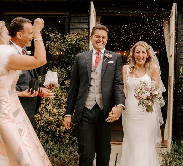 Confetti moment at intimate Clock Barn wedding