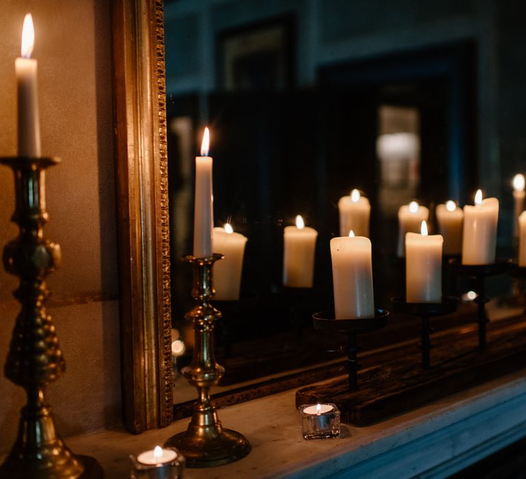 Candle lit mantlepiece for intimate December wedding