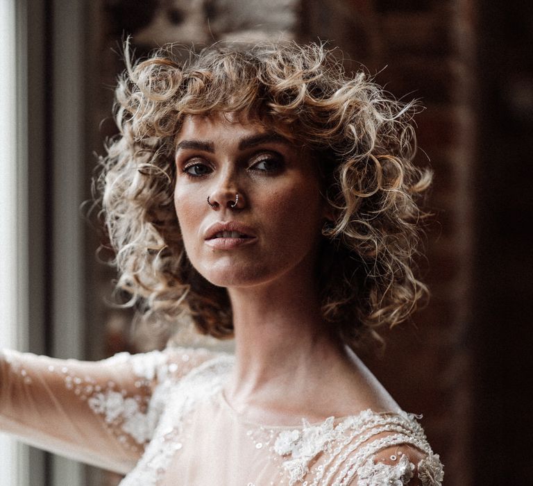 The bride's short curly wedding hair was easy to style with maximum dramatic effect