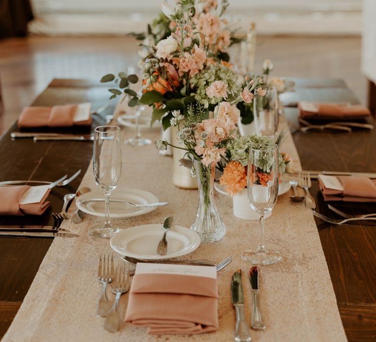 Flower stems in cases as centrepiece wedding decor 