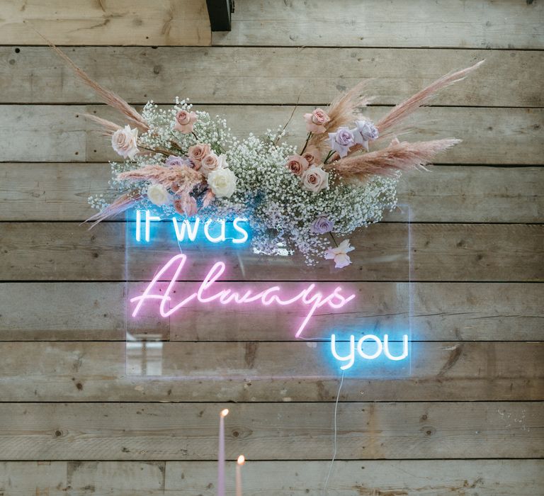 Pink and blue "it was always you' neon sign with gypsophila flower cloud 