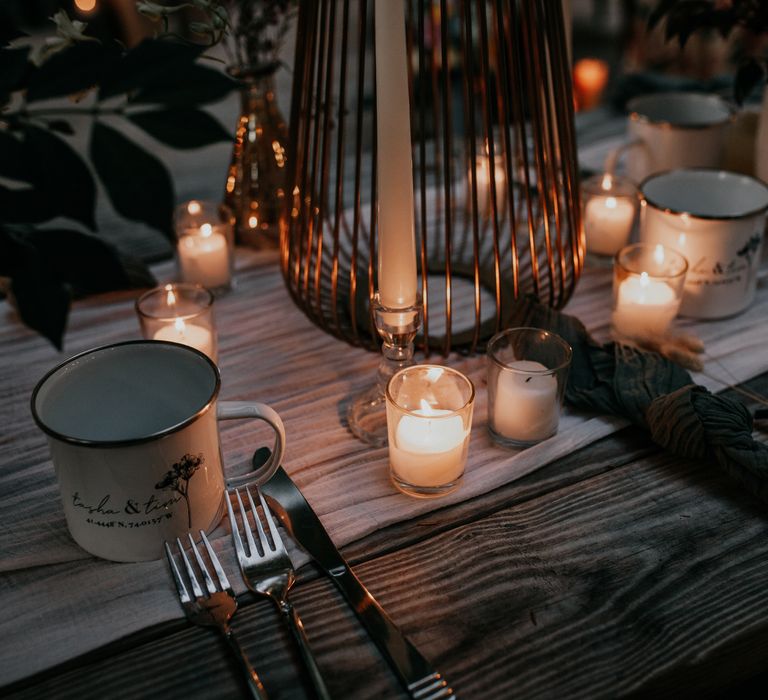 Table setting with personalised cups and green napkins