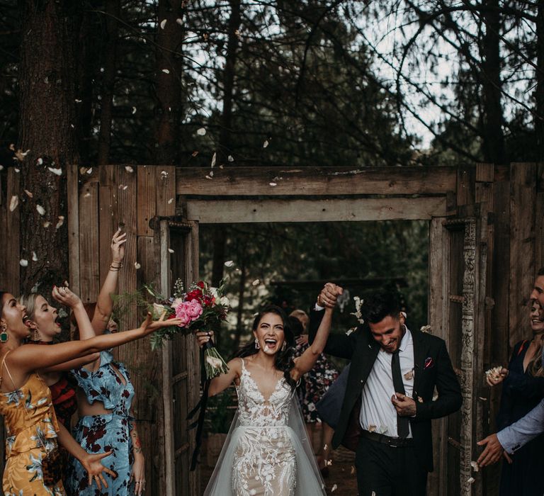 Confetti exit of bride and groom at their rustic outdoor ceremony in South Africa