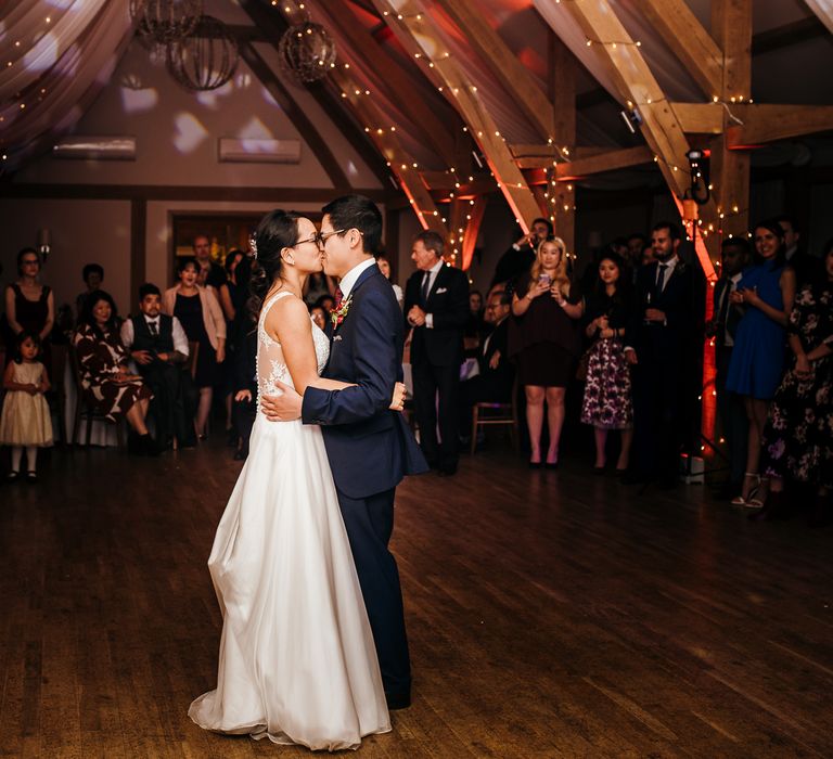 Bride & groom kiss during first dance moment