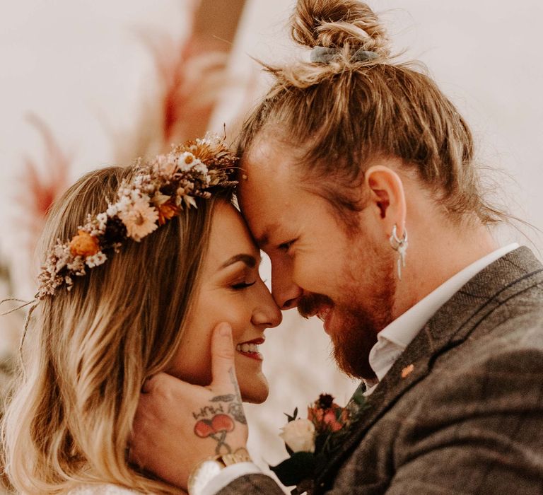 Bride and Groom at boho wedding with beautiful flower crown