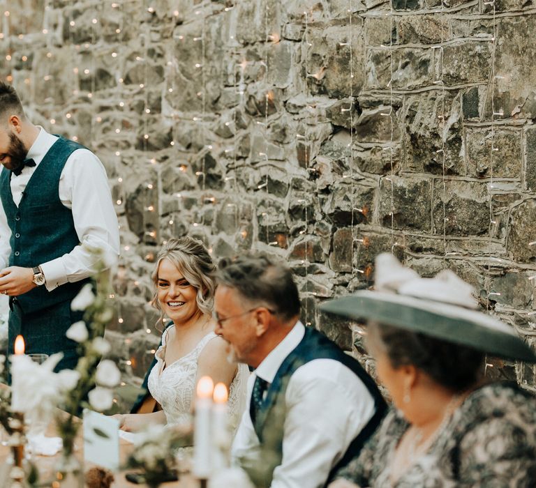 Grooms wedding speech with fairy light background