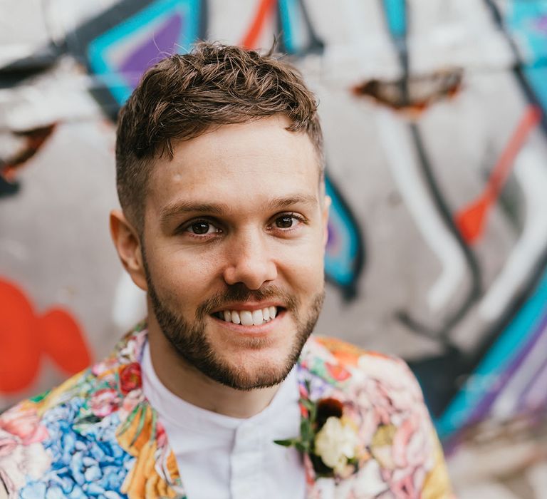 Stylish disabled groom in a patterned blazer for Shoreditch, city elopement 