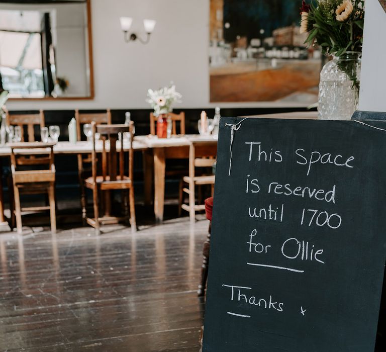 Chalkboard wedding sign at pun wedding reception 