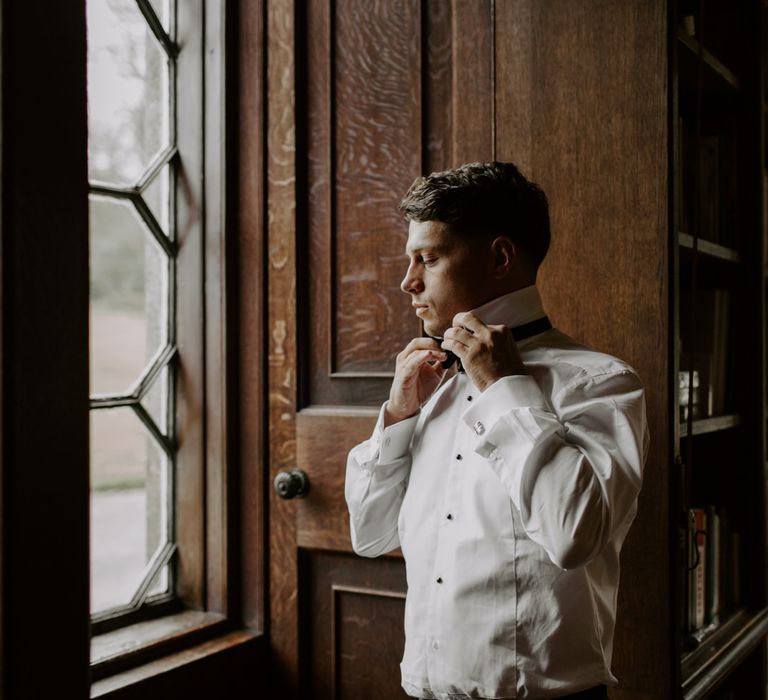 Groom gets ready on the morning of his wedding day