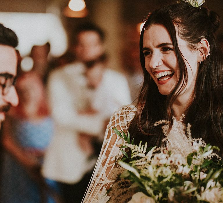 Bride laughs at her groom on wedding day