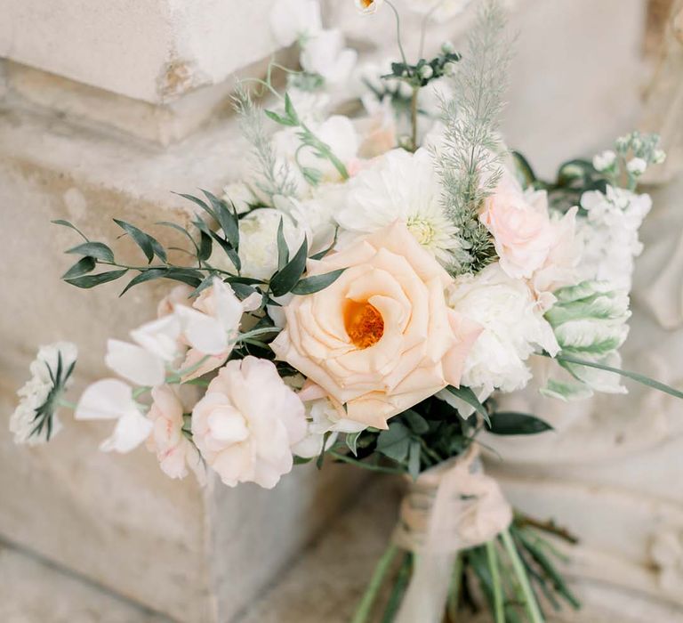 Pastel florals for wedding bouquet tied with ribbon