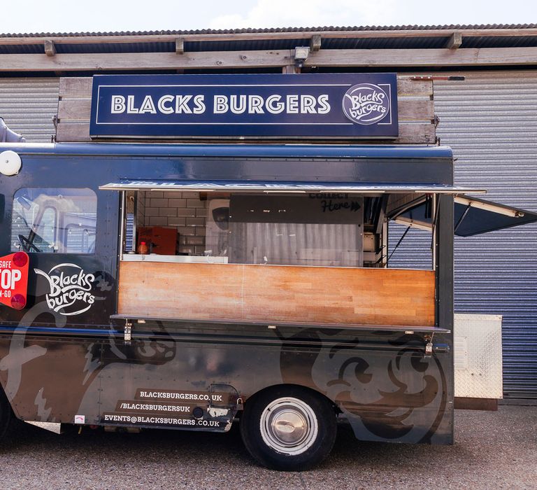 Burger van parked outside barn for festival style wedding in Essex