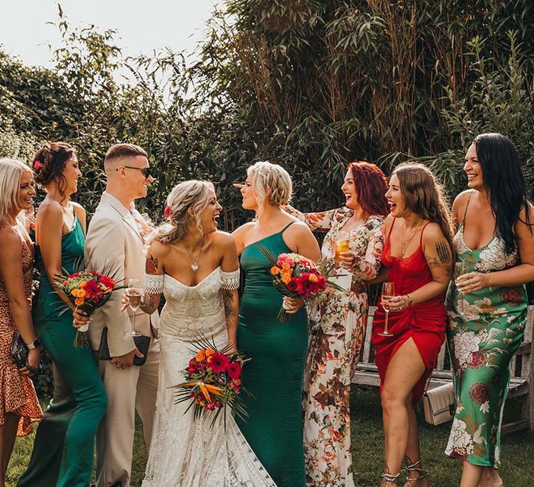 Wedding party in patterned and colourful dresses for tropical vibes and festival style