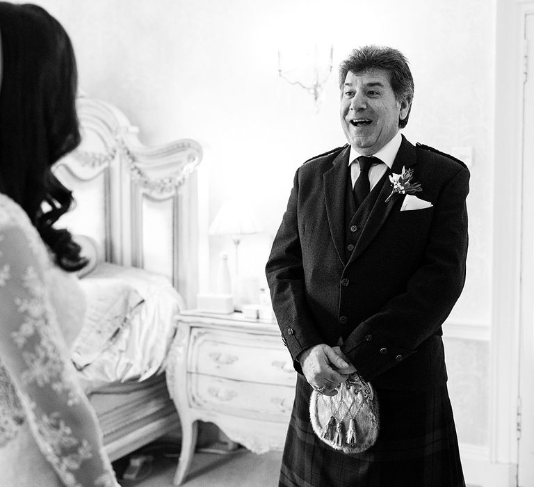 Father of the bride sees his daughter for the first time on the morning of her wedding day