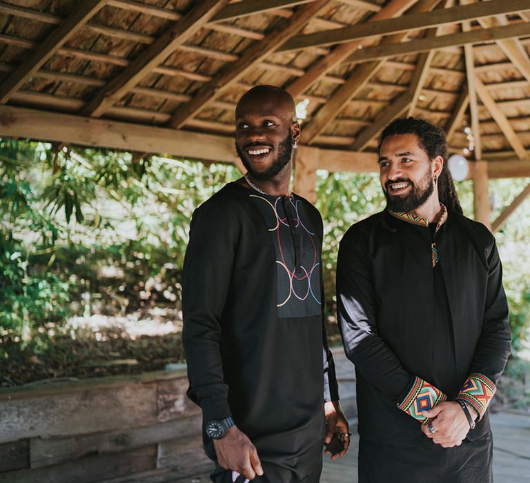 groom an best man in black Caribbean outfits at Deer's Leap Retreat