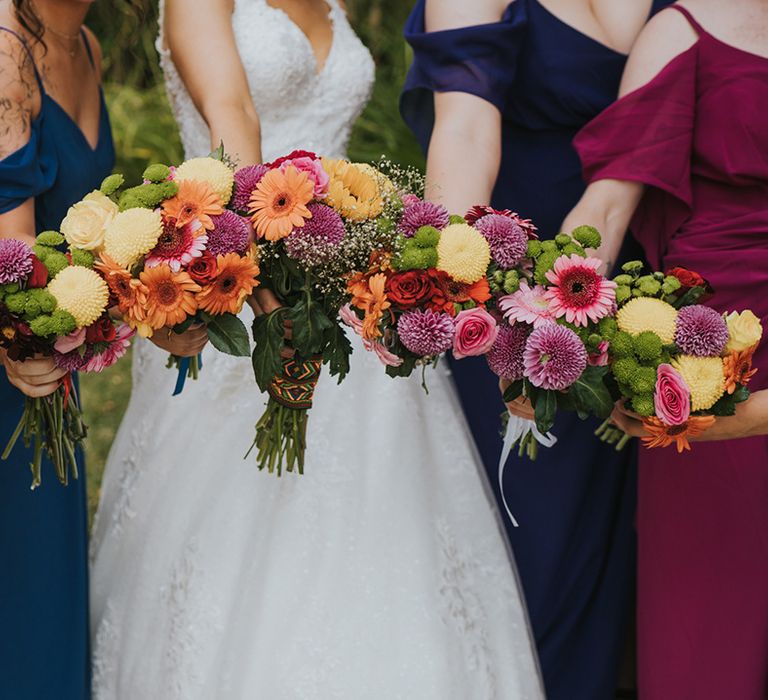 colourful bridesmaid bouquets with roses, dahlias and Gerberas