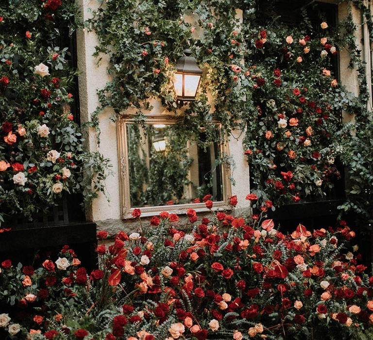 Stunning and beautiful red, orange, and white rose wedding flowers 