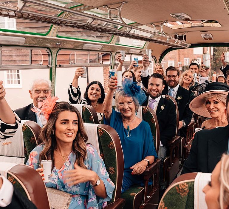 The wedding guests all seated for the bus journey over to the wedding reception and breakfast 