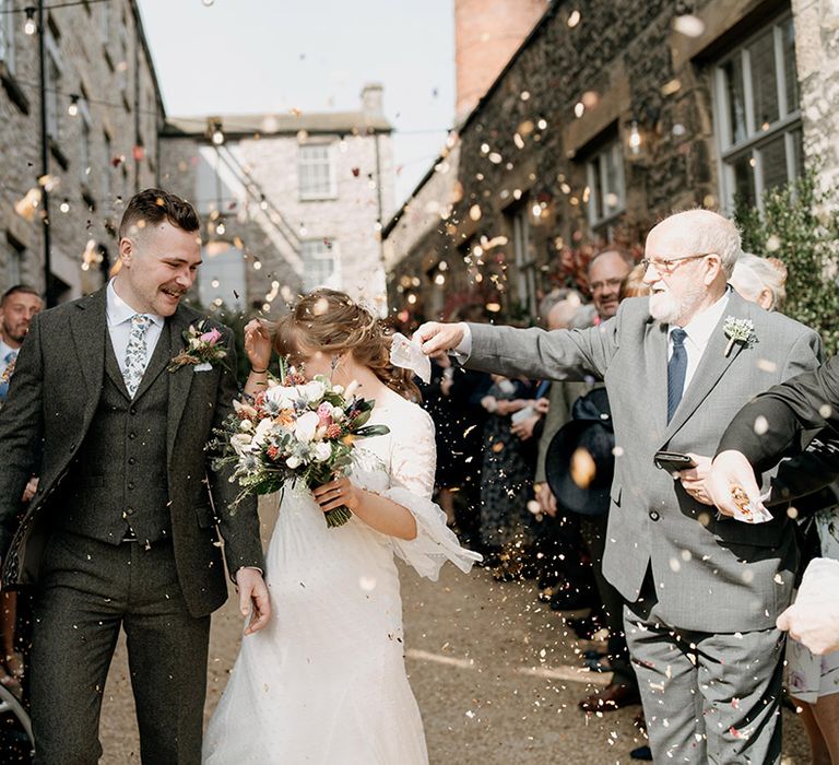 Fun confetti moment for intimate wedding with 40 guests in Lancashire 