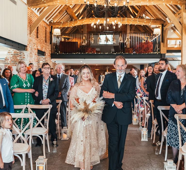 Father of the bride walks the bride down the aisle at Rackleys Barn rustic wedding venue 