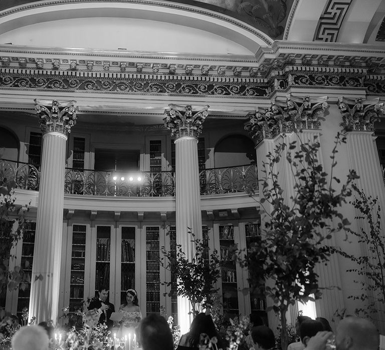 Signet Library wedding breakfast with books surrounding the wedding tables