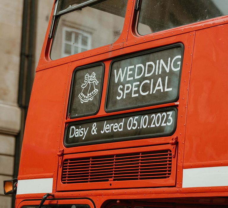 Red double decker bus wedding transport for town hall wedding 