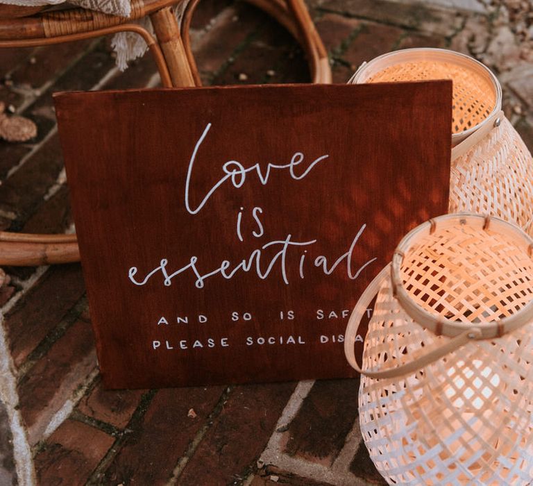 Love is essential wedding signage