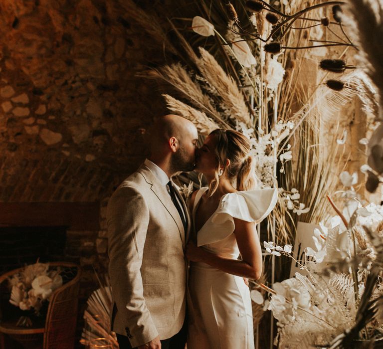 Bride and groom portrait kissing by Darina Stoda Photography