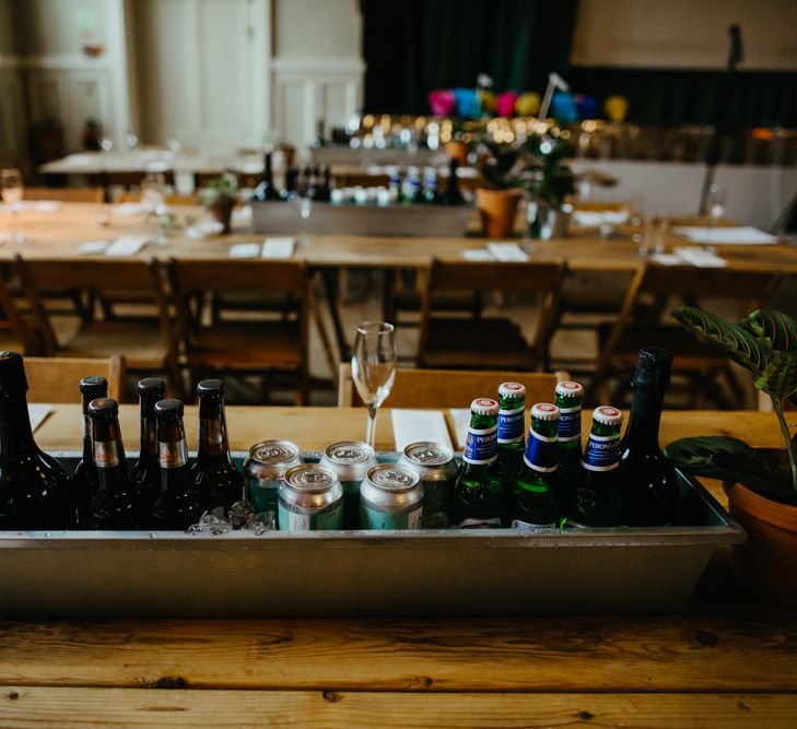 Trough of beer and wine as table centrepieces 