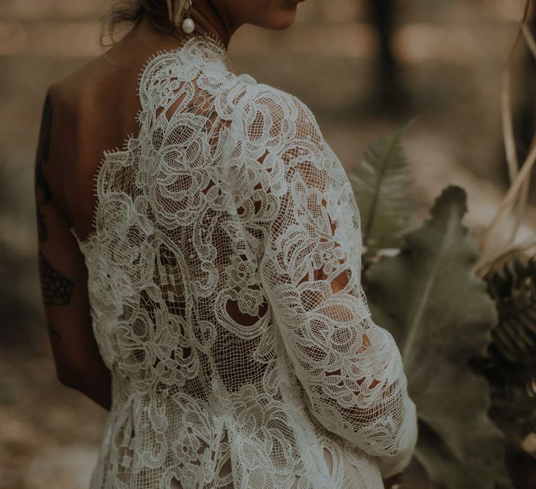 Boho bride in a lace wedding dress with long sleeve 