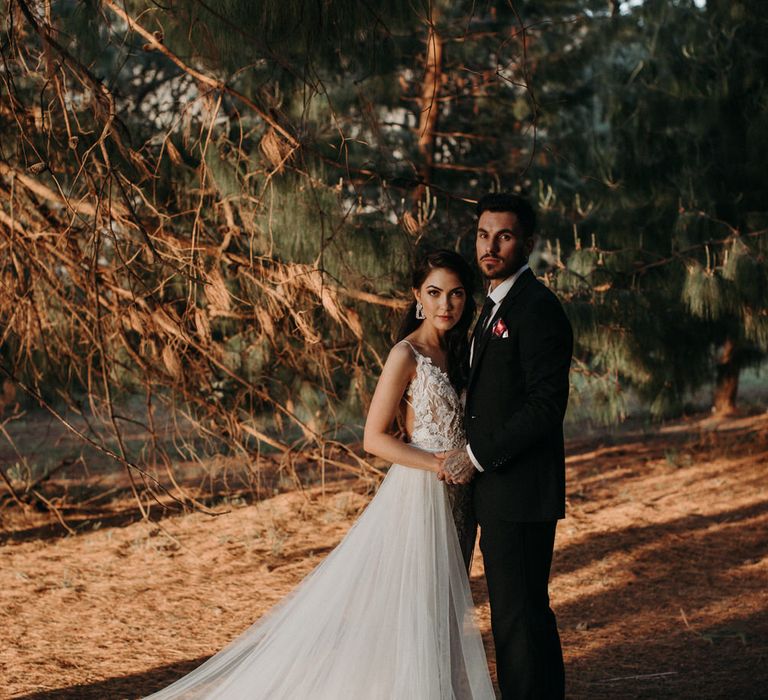 Bride and groom at golden hour in the woods for rustic outdoor wedding in South Africa