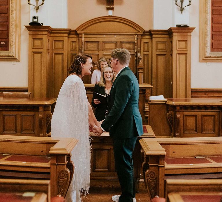 Bride & groom stand at the altar on their wedding day during civil ceremony in Brighton