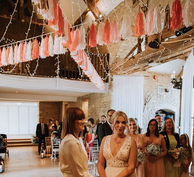 Lesbian wedding ceremony at barn venue