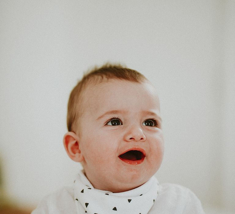 Baby smiles on the day of his parents wedding