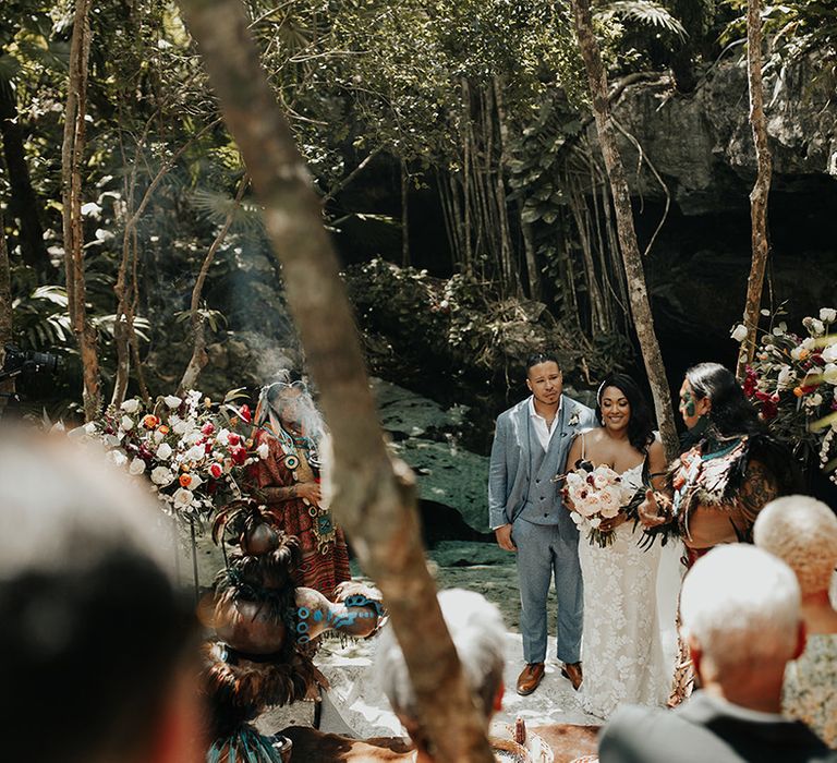 Outdoor wedding ceremony in Cenote El Buho in Tulum in jungle setting