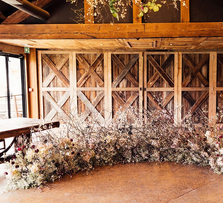 White, pink and red wedding flower cloud display for altar decoration at Dewsall Court