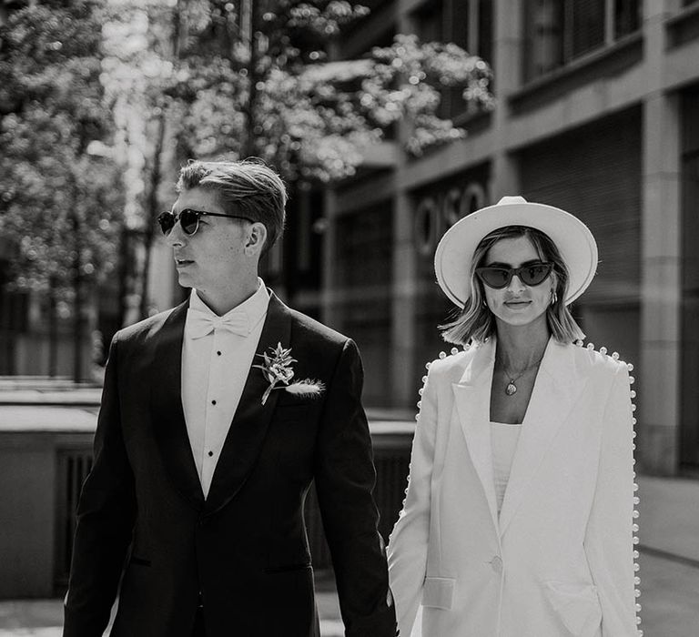 Bride and groom look cool in sunglasses for town hall wedding 