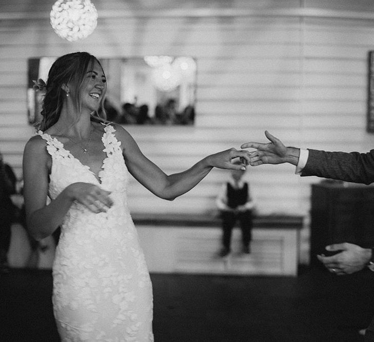 Bride & groom have their first dance in black & white image on their wedding day