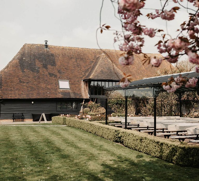 The Old Kent Barn wedding venue outdoor ceremony grounds 