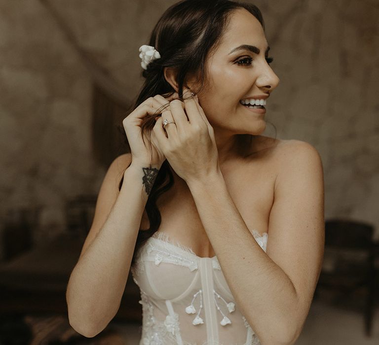 Bride wears fitted corset styled wedding dress