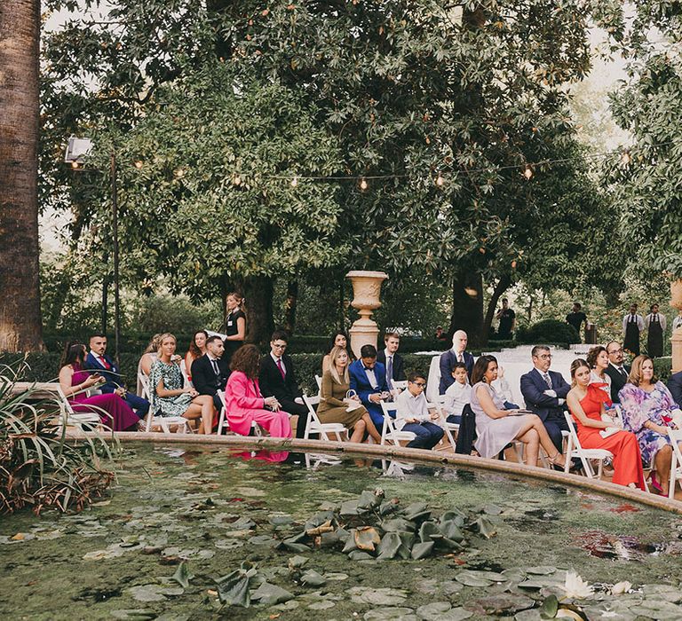 wedding guests at outdoor wedding ceremony in Spain