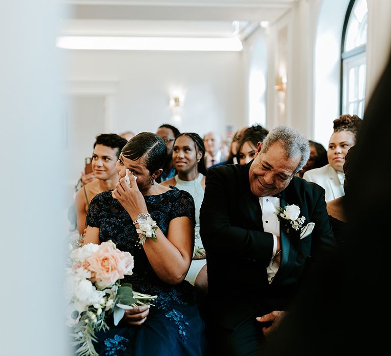 Wedding guests getting emotional at the wedding ceremony 