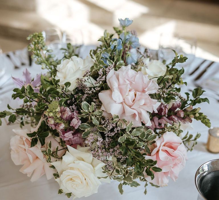 Pastel pink and white flower wedding decorations with roses 