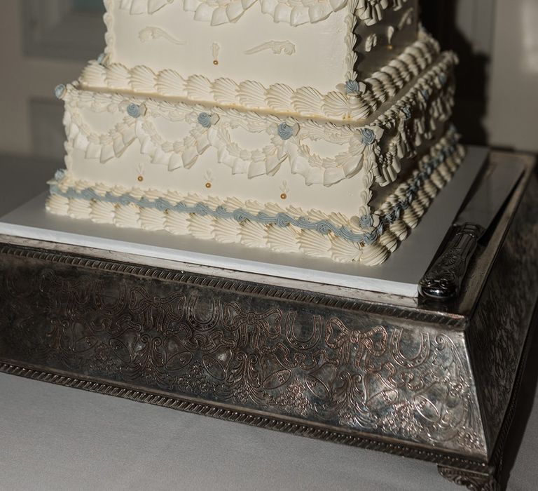 Two tier square retro wedding cake with white and blue icing for city wedding 