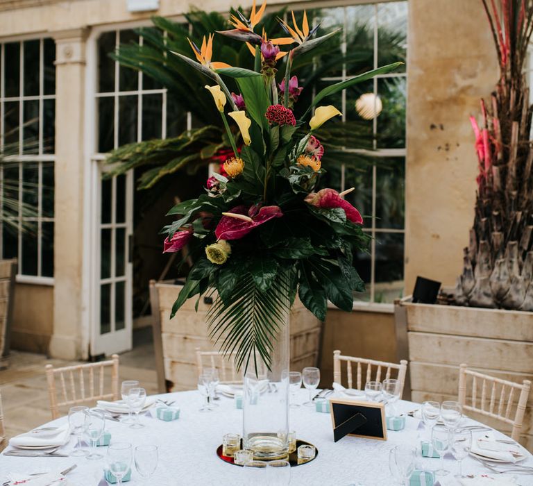 Tropical floral centrepiece at Syon Park Orangery wedding reception