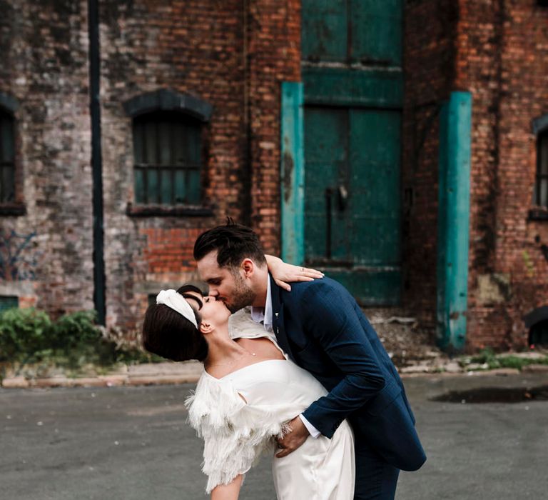 bride and groom kissing at London wedding 