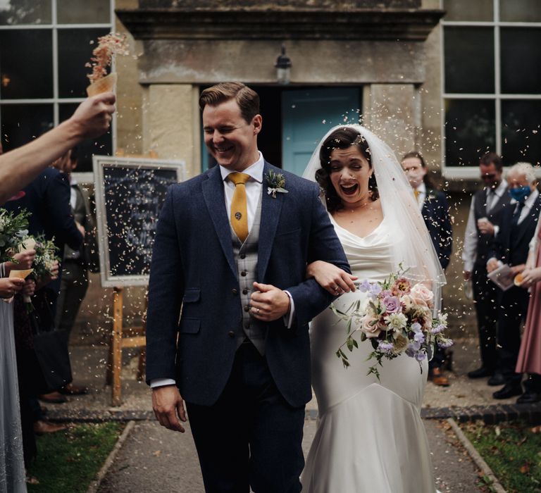 Bride & groom leave chapel 